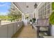 Cozy porch features a wooden bench and a view of a lush garden at 939 Mikell Dr, Charleston, SC 29412
