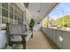 Inviting front porch with a wooden bench, plant, and ample seating at 939 Mikell Dr, Charleston, SC 29412