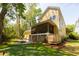 Backyard featuring a putting green, fire pit, patio, and screened-in porch at 1002 Blockade Runner Ct, Charleston, SC 29414