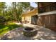Outdoor patio area features a gas grill, dining set, fire pit, and exterior access at 1002 Blockade Runner Ct, Charleston, SC 29414