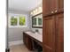 Bathroom vanity area with cabinets and drawers, and a large lighted mirror with makeup lighting at 1002 Blockade Runner Ct, Charleston, SC 29414