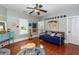 Cozy bedroom with a seating area, hardwood floors, and lots of natural light at 1002 Blockade Runner Ct, Charleston, SC 29414