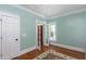 Bright bedroom with French doors, a neutral rug, and ample natural light highlighting its cozy ambiance at 1002 Blockade Runner Ct, Charleston, SC 29414