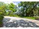 Two-story home featuring a driveway and mature landscaping at 1002 Blockade Runner Ct, Charleston, SC 29414