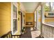 Inviting front porch with swing, columns and painted ceiling at 1002 Blockade Runner Ct, Charleston, SC 29414