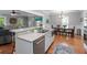 Spacious kitchen with stainless appliances, white cabinets, granite countertops, connecting to dining and living areas at 1002 Blockade Runner Ct, Charleston, SC 29414
