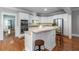 The open-concept kitchen boasts stainless steel appliances and granite countertops and integrates with other living spaces at 1002 Blockade Runner Ct, Charleston, SC 29414
