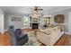Cozy living room with a fireplace, built-in shelves, and plenty of natural light at 1002 Blockade Runner Ct, Charleston, SC 29414
