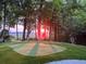 Backyard putting green with lush landscaping and sunset view at 1002 Blockade Runner Ct, Charleston, SC 29414