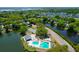 Aerial view of a community highlighting pools, tennis courts, ponds, and green landscaping at 1006 Wayfarer Ln, Charleston, SC 29412