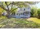 Beautiful backyard with a spacious deck overlooking the lush lawn and gardens with mature shade trees at 1006 Wayfarer Ln, Charleston, SC 29412