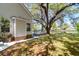 Exterior view of the home with lush backyard landscaping and lake access, creating a private oasis at 1006 Wayfarer Ln, Charleston, SC 29412