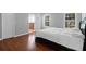 Bedroom features wood-look floors, white trim, lots of natural light and en suite bathroom at 1006 Wayfarer Ln, Charleston, SC 29412