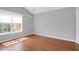 Bedroom features vaulted ceiling, wood-look floors, and window at 1006 Wayfarer Ln, Charleston, SC 29412