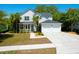 Charming two-story home featuring a well-manicured lawn and an attached two-car garage at 1006 Wayfarer Ln, Charleston, SC 29412