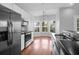 Bright kitchen features stainless steel appliances, mosaic backsplash and lots of natural light at 1006 Wayfarer Ln, Charleston, SC 29412