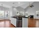 Stylish kitchen featuring stainless steel appliances and a breakfast bar overlooking the living area at 1006 Wayfarer Ln, Charleston, SC 29412