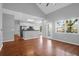 Open-concept living space with hardwood floors, bright windows, and kitchen access at 1006 Wayfarer Ln, Charleston, SC 29412