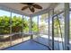 Relaxing screened porch with water view, ceiling fan, and charming string lights, perfect for outdoor enjoyment at 1006 Wayfarer Ln, Charleston, SC 29412