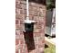 Close-up of the brick exterior with electrical utility box, providing exterior power source at 1009 Highland Pines Rd, Ladson, SC 29456