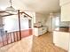 Open concept kitchen with white cabinets, tile flooring and a view of the living room at 1009 Highland Pines Rd, Ladson, SC 29456