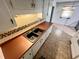 Kitchen featuring a dual sink, wood countertops, tile backsplash and flooring at 1009 Highland Pines Rd, Ladson, SC 29456