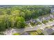 An aerial view capturing well-maintained homes nestled among lush trees in a quiet neighborhood at 102 Vango Dr, Goose Creek, SC 29445