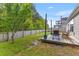 Backyard featuring a wooden deck with rocking chairs, a basketball hoop, and a wooden fence around the perimeter at 102 Vango Dr, Goose Creek, SC 29445