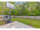 Large backyard featuring a basketball court, a wooden deck with outdoor seating, and a wooden fence around the perimeter at 102 Vango Dr, Goose Creek, SC 29445