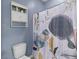 Cozy bathroom featuring a toilet, shower with curtain, and wall shelf at 102 Vango Dr, Goose Creek, SC 29445
