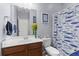 Bright bathroom featuring blue walls, vanity with sink, toilet and decor at 102 Vango Dr, Goose Creek, SC 29445