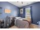 Stylish bedroom with a desk, chair, comfortable bed, and a window with natural light at 102 Vango Dr, Goose Creek, SC 29445