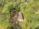 Scenic aerial view of a home surrounded by verdant trees, offering a secluded and peaceful environment at 103 Bush Dr, Bonneau, SC 29431