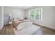 Cozy bedroom featuring natural light, plush bedding, and stylish decor at 103 Bush Dr, Bonneau, SC 29431