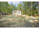 Charming single-story home with a welcoming front porch, set in a tranquil, wooded area at 103 Bush Dr, Bonneau, SC 29431