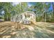 Charming single-story home with a covered porch and gray siding at 103 Bush Dr, Bonneau, SC 29431