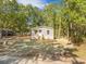 Charming home with a welcoming porch, complemented by lush trees, offering a blend of comfort and nature at 103 Bush Dr, Bonneau, SC 29431