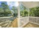 Inviting front porch with wooden railings and steps, perfect for enjoying the outdoors at 103 Bush Dr, Bonneau, SC 29431
