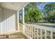 Close-up of a welcoming front porch featuring new wood steps and white railings, enhancing curb appeal at 103 Bush Dr, Bonneau, SC 29431