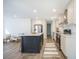 Open kitchen with island, stainless steel appliances, and seamless flow to the living area at 103 Bush Dr, Bonneau, SC 29431