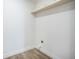 Functional laundry area with convenient shelving and necessary hookups, offering practicality and organization at 103 Bush Dr, Bonneau, SC 29431