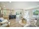 Open concept living area with an island kitchen, seating, and hardwood floors at 103 Bush Dr, Bonneau, SC 29431