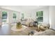 Inviting living room featuring plenty of natural light, hardwood floors, and modern decor at 103 Bush Dr, Bonneau, SC 29431