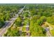 Aerial view showcasing a neighborhood with mature trees along the tree-lined main road at 1104 Margaret Dr, Ladson, SC 29456