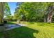 This backyard features green grass and trees in the background, perfect for relaxing outdoors at 1104 Margaret Dr, Ladson, SC 29456