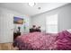 Bedroom features a comfy bed, wood flooring, and a TV for entertainment at 1104 Margaret Dr, Ladson, SC 29456