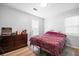 Cozy bedroom showcases a comfortable bed, dresser, and a bright window at 1104 Margaret Dr, Ladson, SC 29456