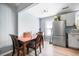 Dining area with light wood-look floors and stainless refrigerator at 1104 Margaret Dr, Ladson, SC 29456