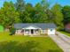 Charming brick home with a manicured lawn and attached garage, perfect for suburban living at 1104 Margaret Dr, Ladson, SC 29456