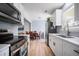 Well-lit kitchen with white cabinets and stainless appliances at 1104 Margaret Dr, Ladson, SC 29456